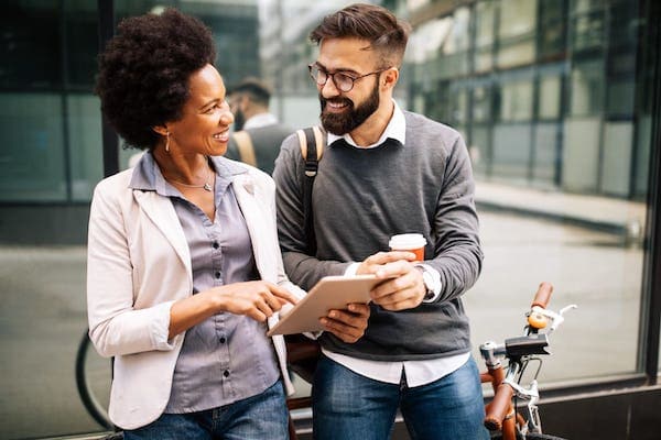 Two people looking at a clipboard