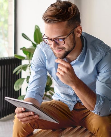 young man on ipad